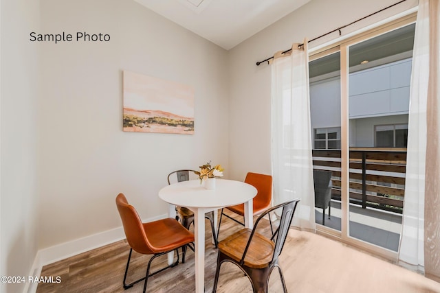 dining room with hardwood / wood-style floors