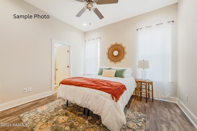 bedroom featuring ceiling fan and hardwood / wood-style flooring