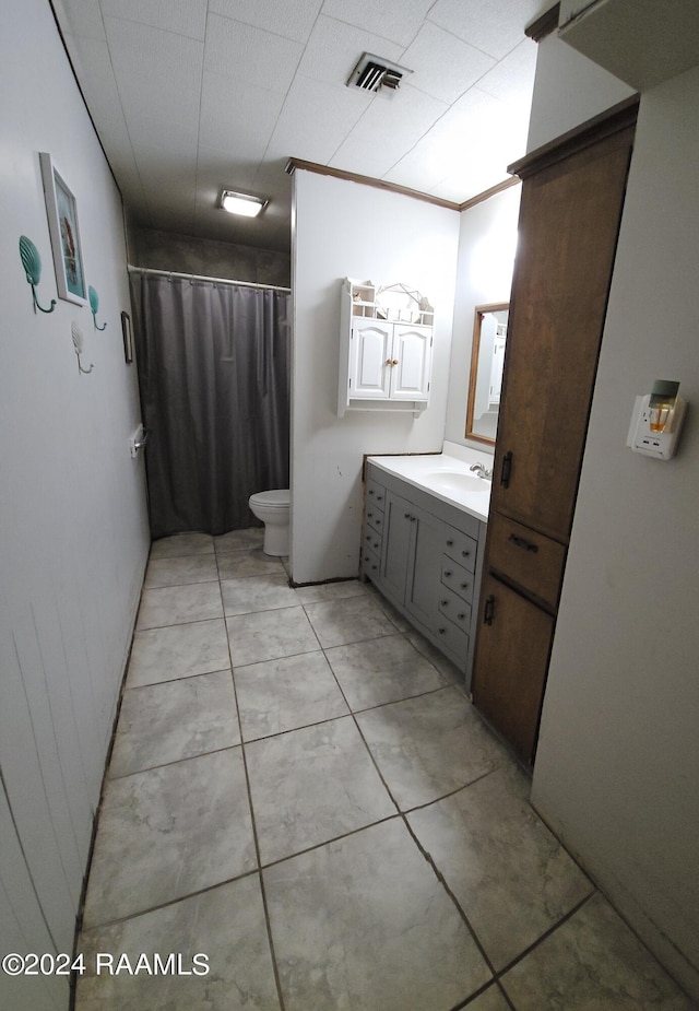 bathroom featuring vanity, crown molding, curtained shower, and toilet