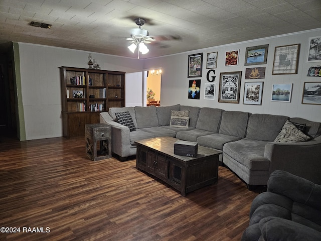 living room featuring ornamental molding and dark hardwood / wood-style floors