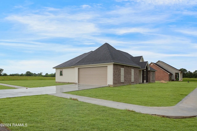 view of property exterior featuring a lawn, roof with shingles, concrete driveway, an attached garage, and brick siding