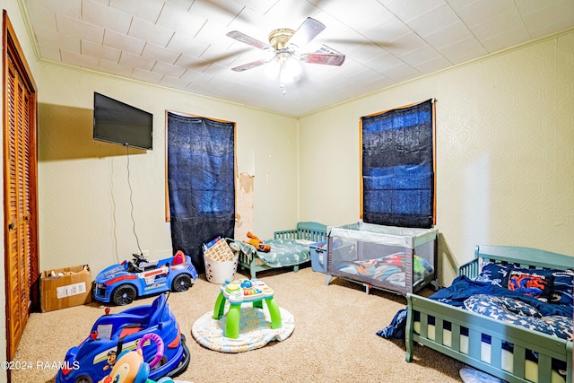 1605 Charity St, Abbeville, LA 70510 - bedroom with a textured wall, carpet, and ceiling fan