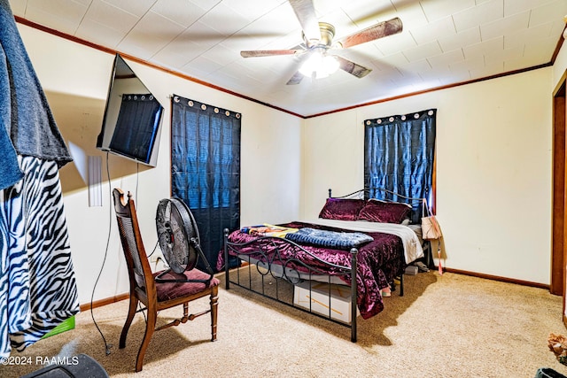 1605 Charity St, Abbeville, LA 70510 - carpeted bedroom with baseboards, ornamental molding, and a ceiling fan