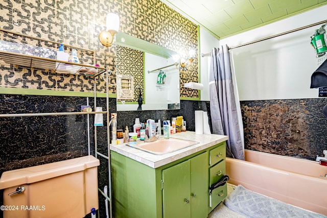 full bathroom with tile walls, toilet, vanity, and shower / bath combo