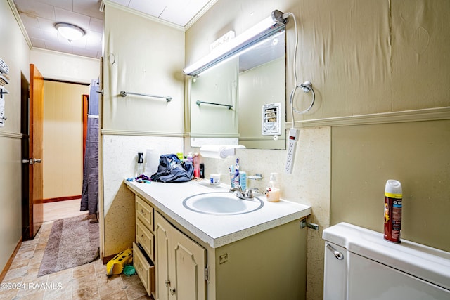 1605 Charity St, Abbeville, LA 70510 - bathroom featuring toilet, vanity, and ornamental molding