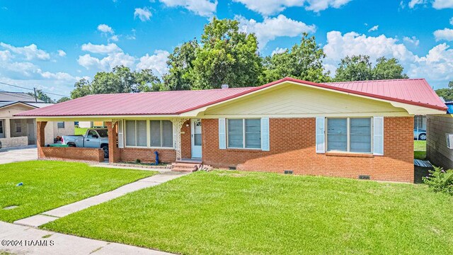 single story home with a front lawn and a carport