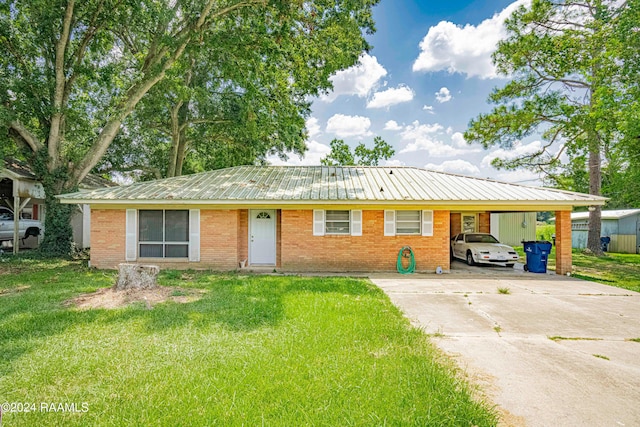 ranch-style house with a carport and a front yard