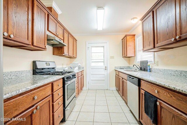 kitchen with crown molding, range with two ovens, light stone counters, and stainless steel dishwasher