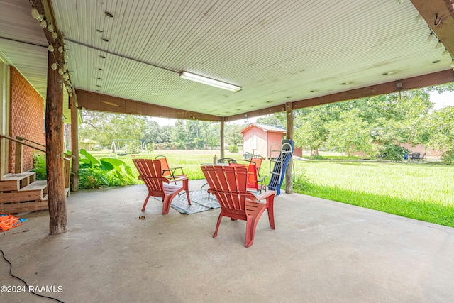 view of patio featuring a shed