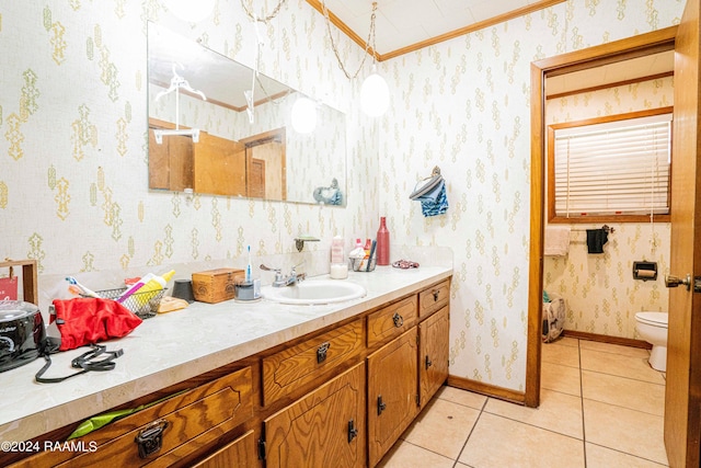 bathroom with vanity, crown molding, tile patterned floors, and toilet