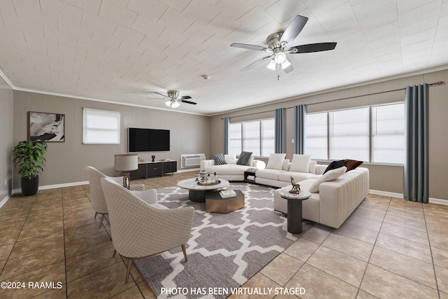 living room featuring tile patterned flooring, crown molding, an AC wall unit, and ceiling fan