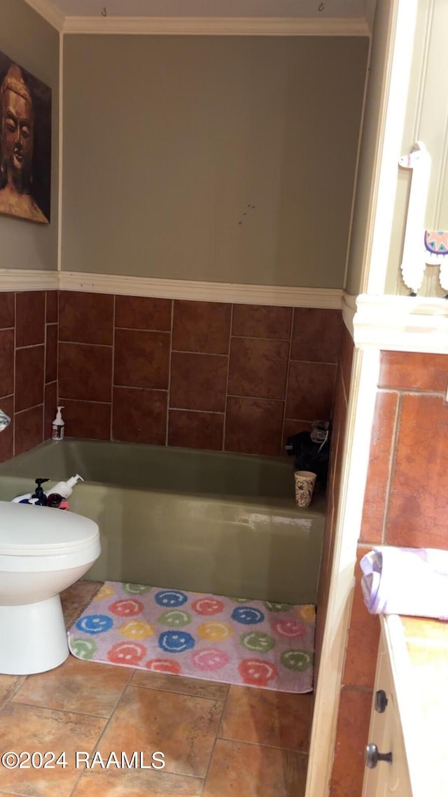 bathroom with toilet, vanity, a bath, and tile patterned floors