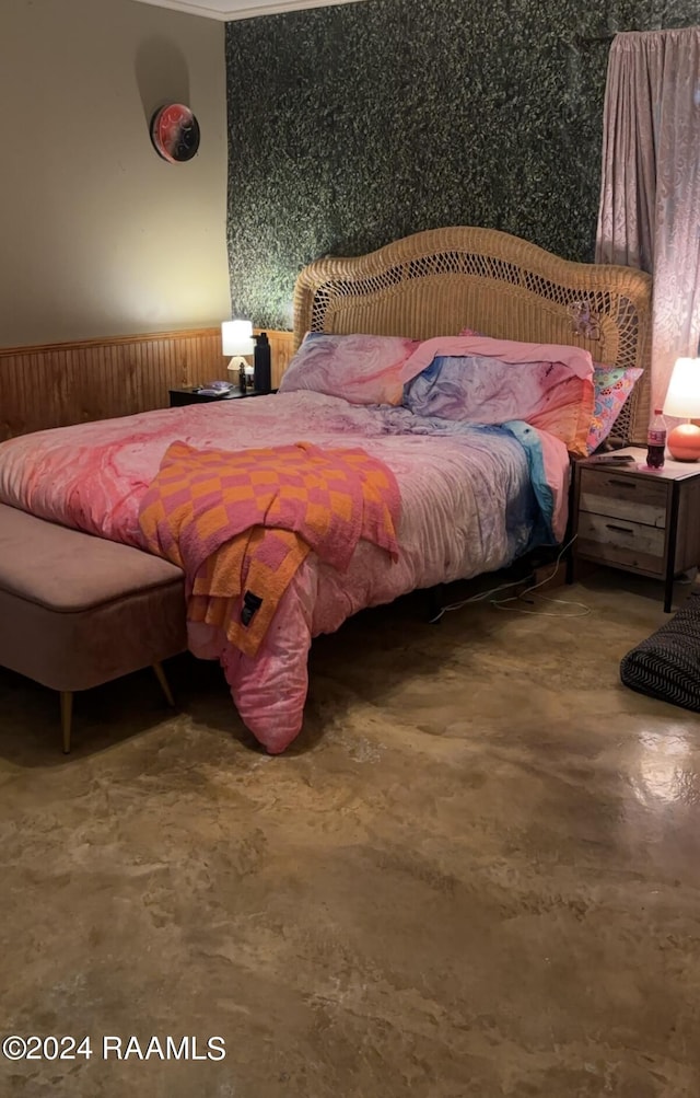 bedroom featuring finished concrete flooring