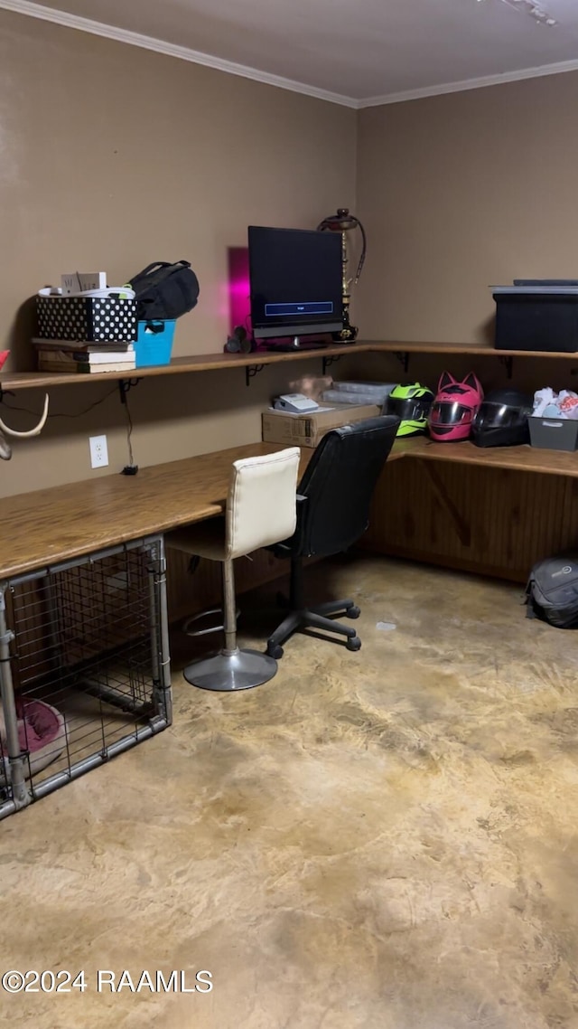 office area with ornamental molding and concrete floors