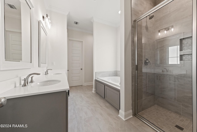 bathroom with ornamental molding, visible vents, a sink, and a garden tub