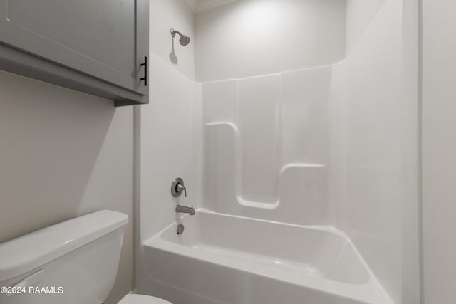 bathroom with toilet and washtub / shower combination