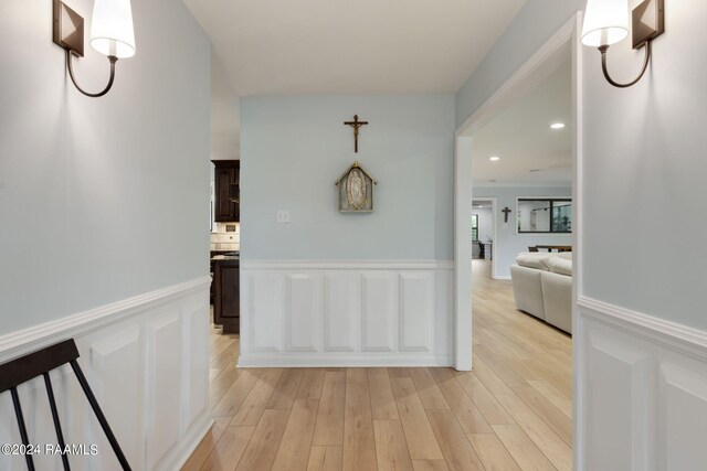 hallway with light hardwood / wood-style flooring