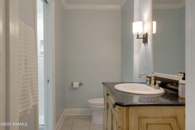 bathroom featuring vanity, toilet, ornamental molding, and tile patterned floors