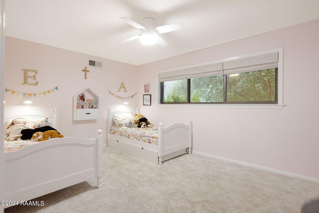 carpeted bedroom featuring ceiling fan