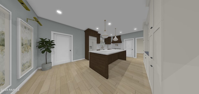 kitchen with light wood-type flooring, pendant lighting, a chandelier, and a kitchen island