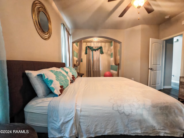 bedroom featuring ceiling fan and dark wood-type flooring