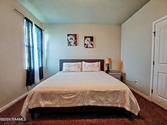 bedroom with dark carpet