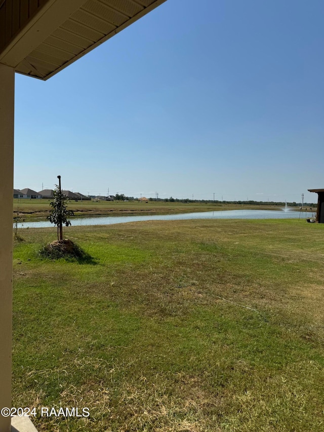 view of yard with a water view