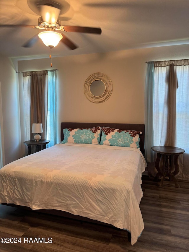 bedroom featuring ceiling fan and hardwood / wood-style floors