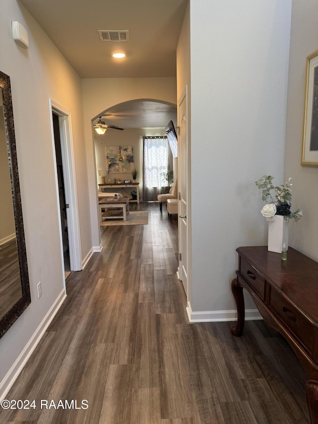 3134 Asbury Cir, Lake Charles, LA 70607 - corridor featuring baseboards, visible vents, arched walkways, and dark wood finished floors