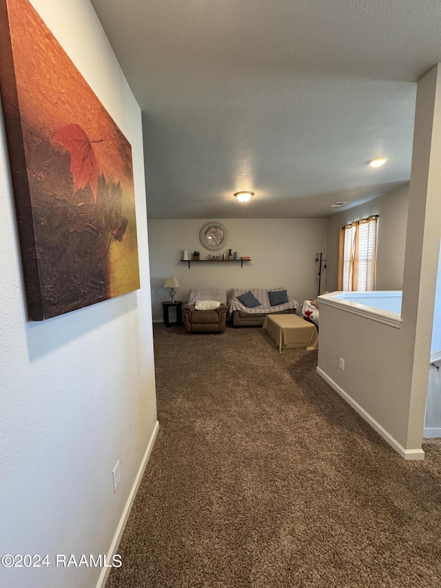 3134 Asbury Cir, Lake Charles, LA 70607 - living room featuring carpet, a textured ceiling, and baseboards