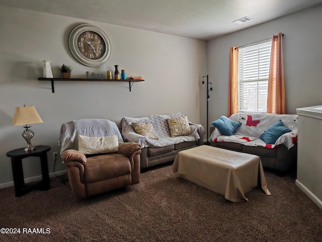 living room featuring dark colored carpet