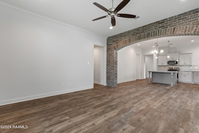 unfurnished living room featuring ceiling fan, wood-type flooring, and ornamental molding