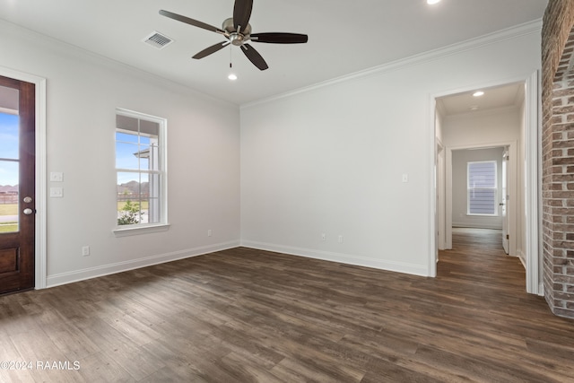 interior space with dark wood-type flooring, ceiling fan, and crown molding