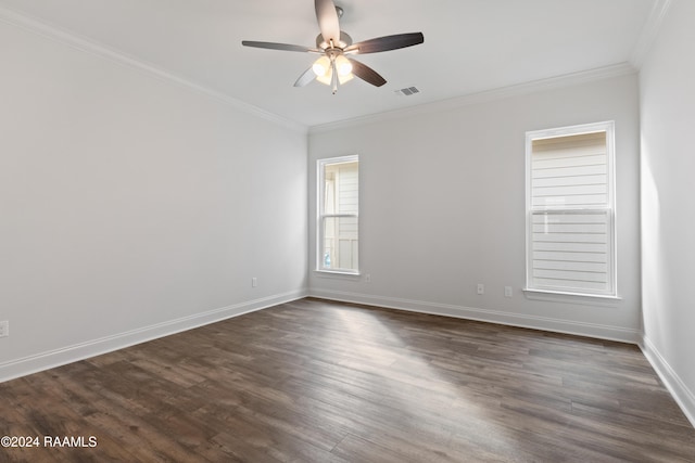 spare room with dark hardwood / wood-style flooring, ceiling fan, and crown molding