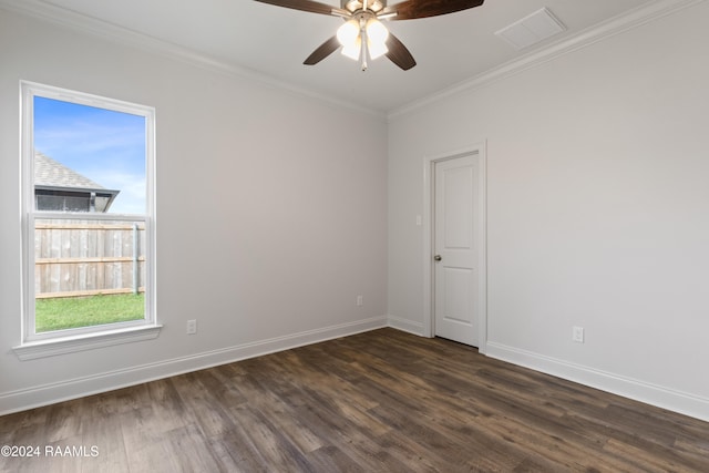 empty room featuring ceiling fan, crown molding, and dark hardwood / wood-style flooring