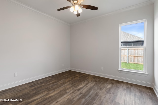 spare room with dark wood-type flooring, ceiling fan, plenty of natural light, and crown molding