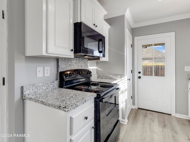 kitchen with light stone countertops, black appliances, light hardwood / wood-style floors, ornamental molding, and white cabinets