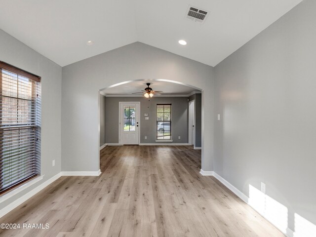 unfurnished living room with lofted ceiling, ceiling fan, and light hardwood / wood-style floors