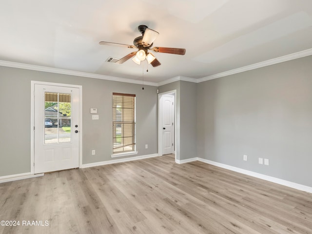 spare room with crown molding, ceiling fan, and light hardwood / wood-style floors