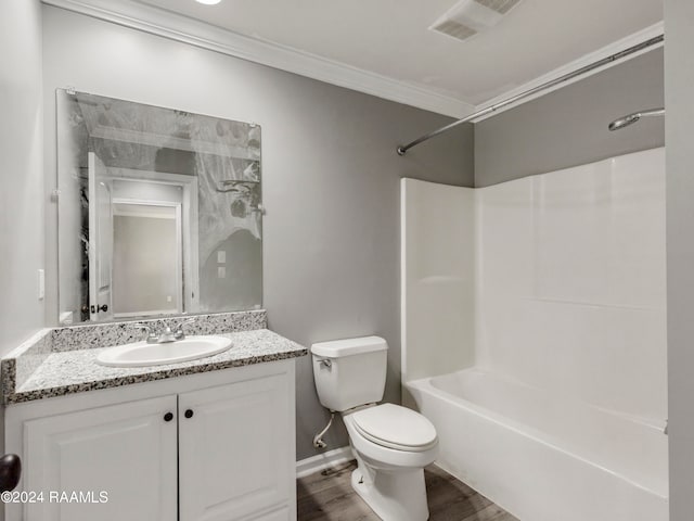 full bathroom with toilet, crown molding, vanity, shower / bathtub combination, and hardwood / wood-style flooring