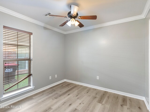 spare room featuring light wood-type flooring, crown molding, and ceiling fan