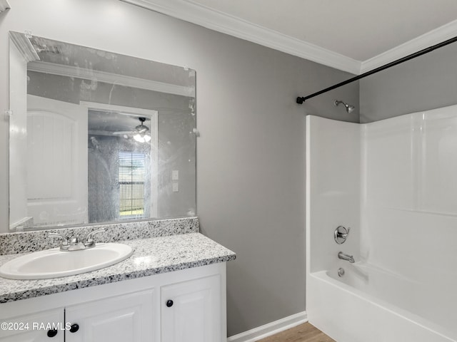 bathroom featuring crown molding, vanity, shower / bath combination, and hardwood / wood-style flooring