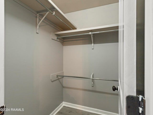 walk in closet featuring hardwood / wood-style flooring