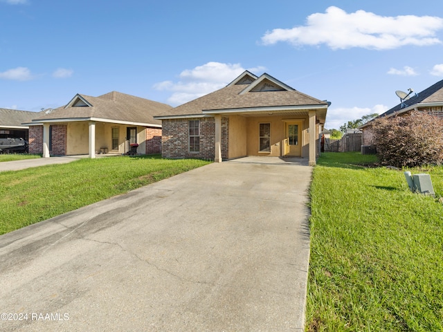 ranch-style home with a front lawn