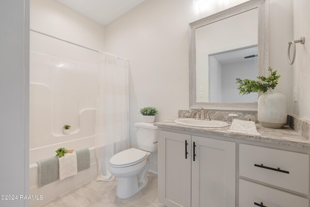 full bathroom featuring shower / bath combo, toilet, tile patterned floors, and vanity