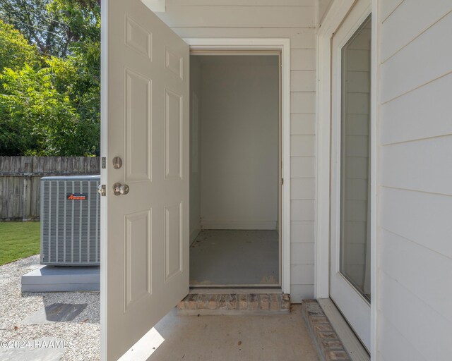 doorway to property with central air condition unit