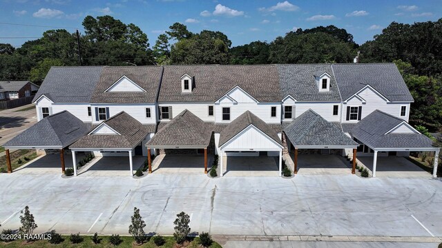 view of front of home featuring a carport and a garage