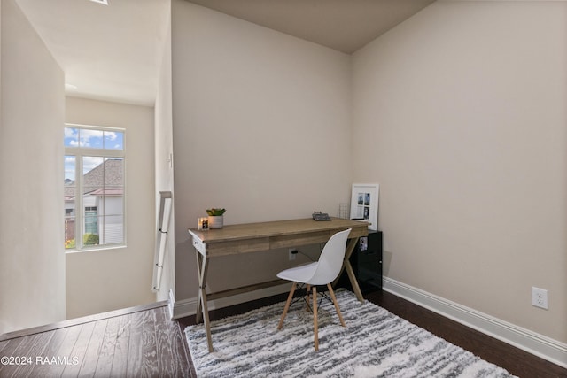 office space featuring dark wood-type flooring and a wealth of natural light