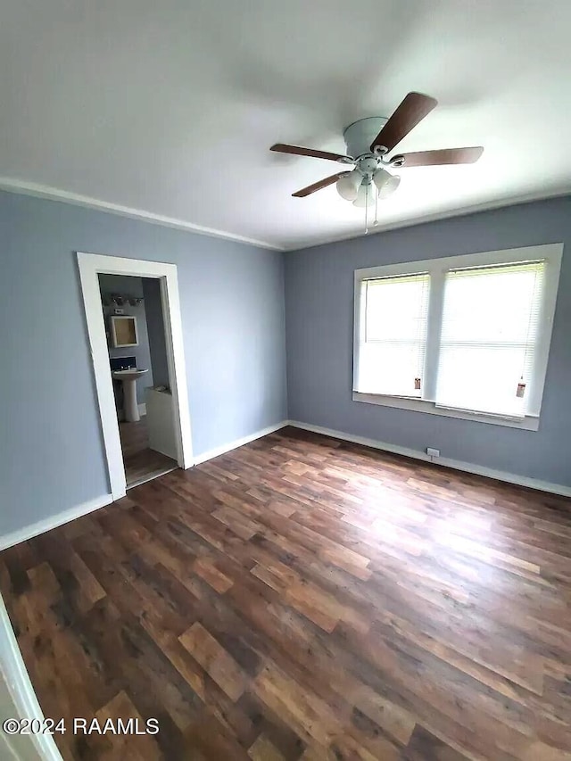 empty room with ceiling fan and dark hardwood / wood-style floors