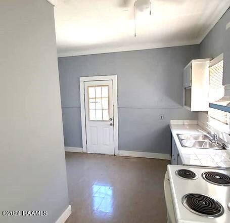 kitchen featuring white cabinetry, ornamental molding, white electric stove, and sink